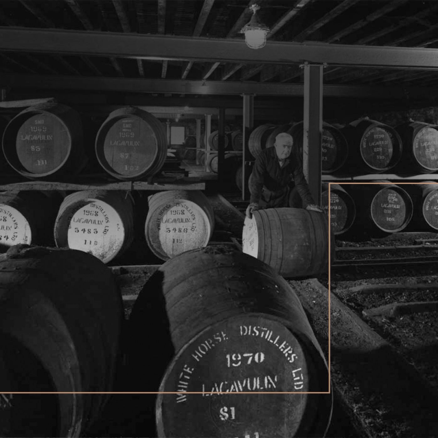 Black-and-white photograph of Lagavulin casks in a warehouse