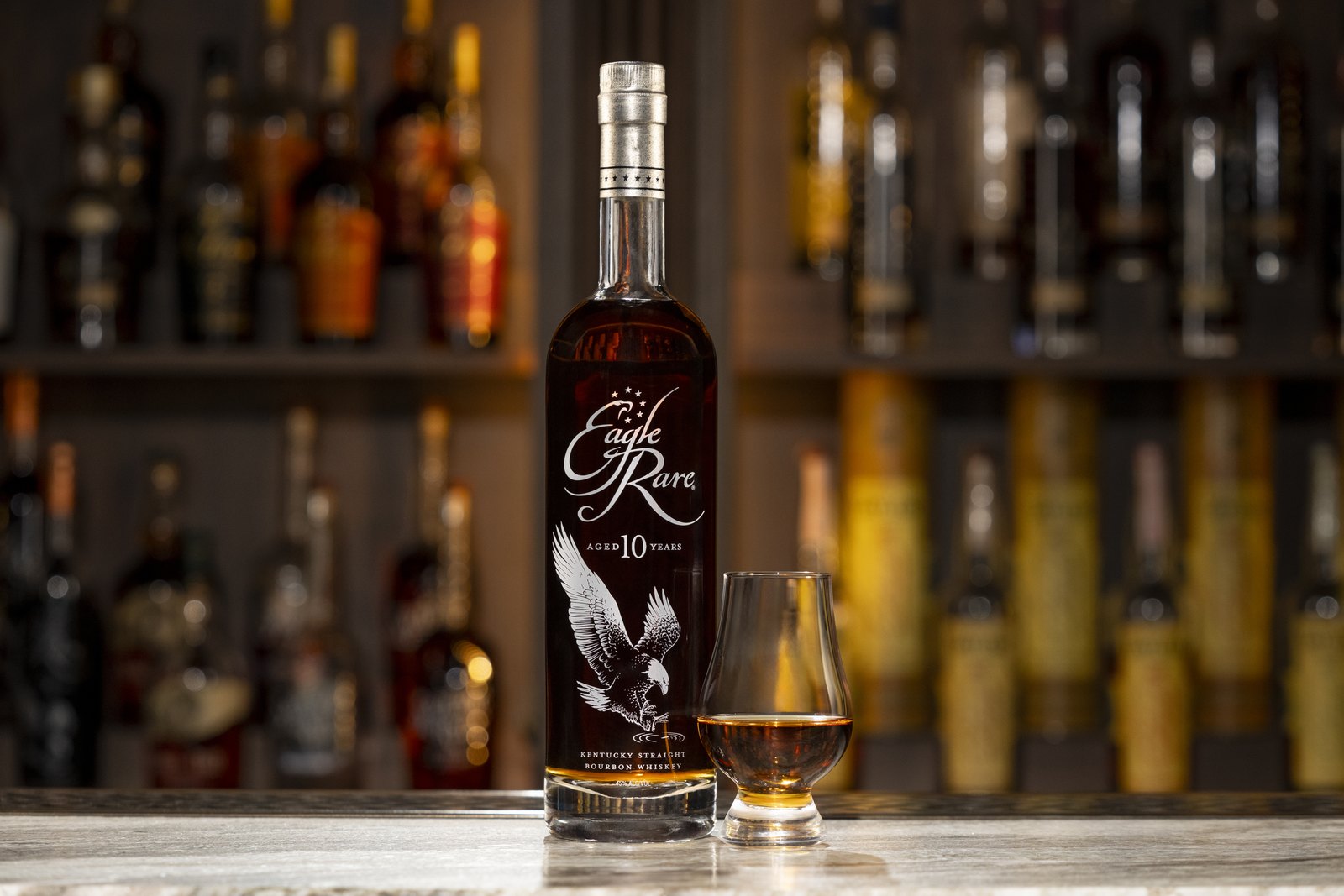 Eagle Rare 10 bottle and glass on a bar