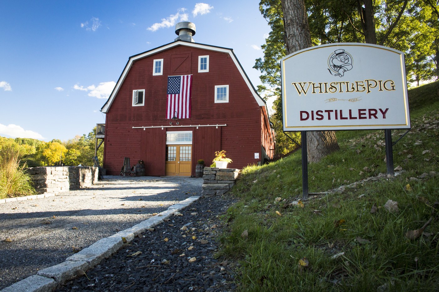Red barn and WhistlePig Distillery sign